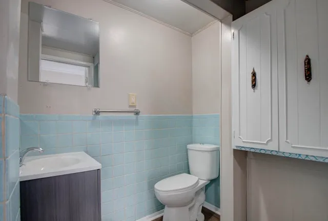 a bathroom with a sink mirror and a bathtub