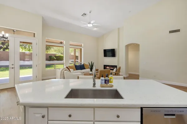 a living room with furniture and large windows
