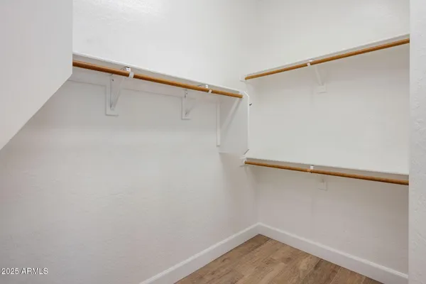 a view of an empty walk in closet