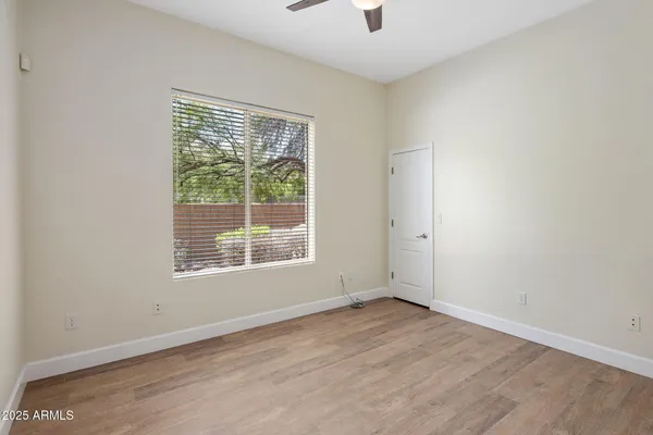 a bathroom with a granite countertop double vanity sink toilet and shower