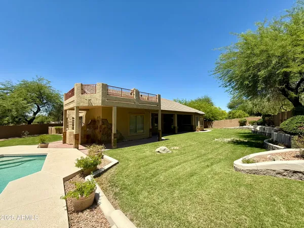 a backyard of a house with lots of green space