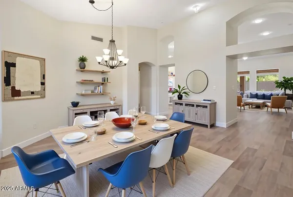 a building outdoor space with patio furniture and potted plants