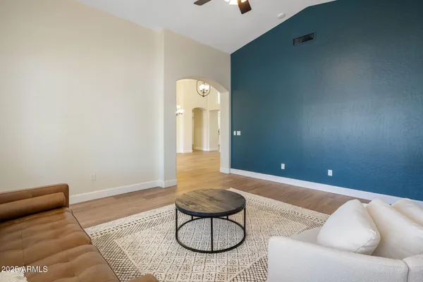 a living room with furniture and a large window