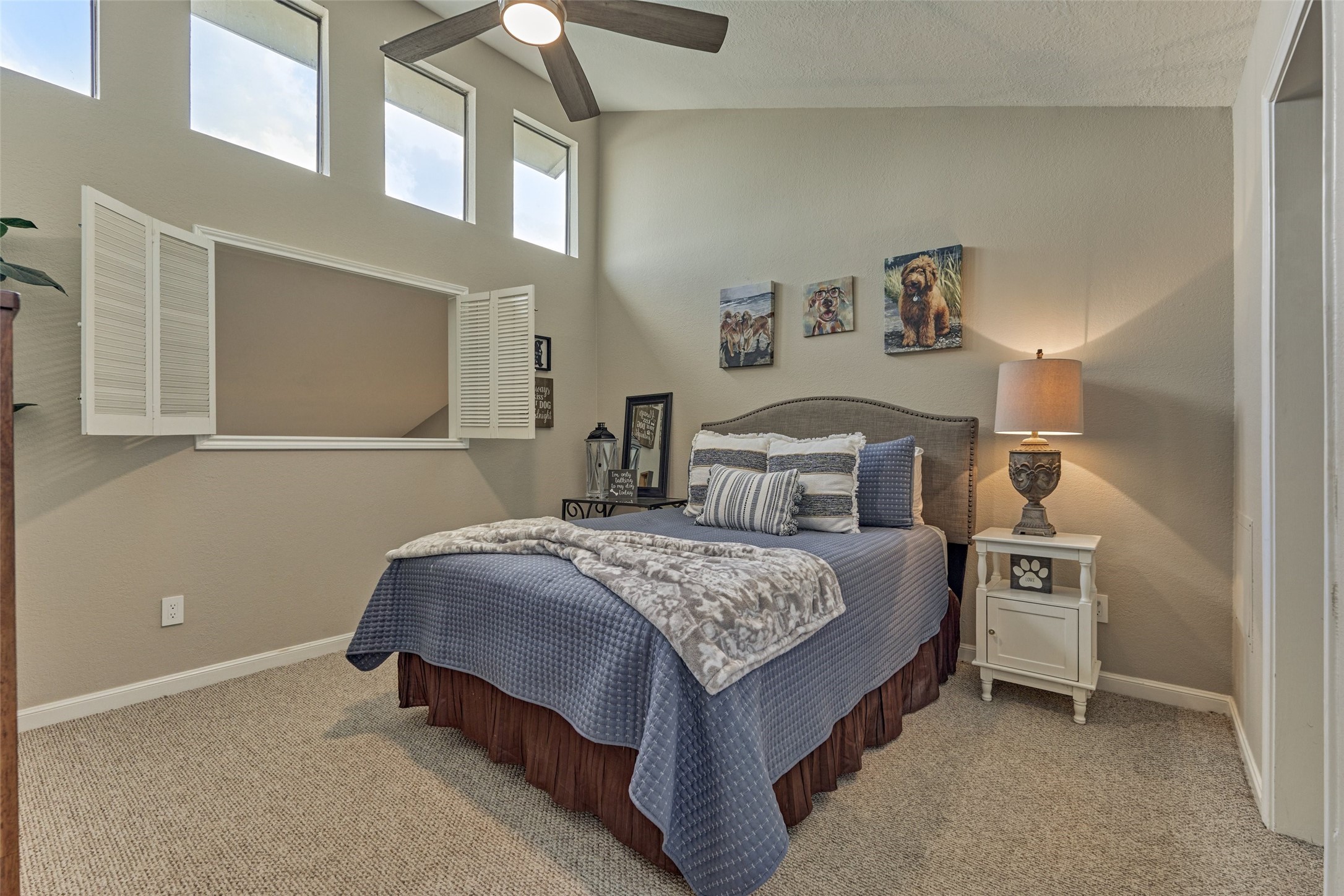 5 April Point Drive South Montgomery, TX 77356 - Photo 17 of 26 a bedroom with a bed and a cabinets