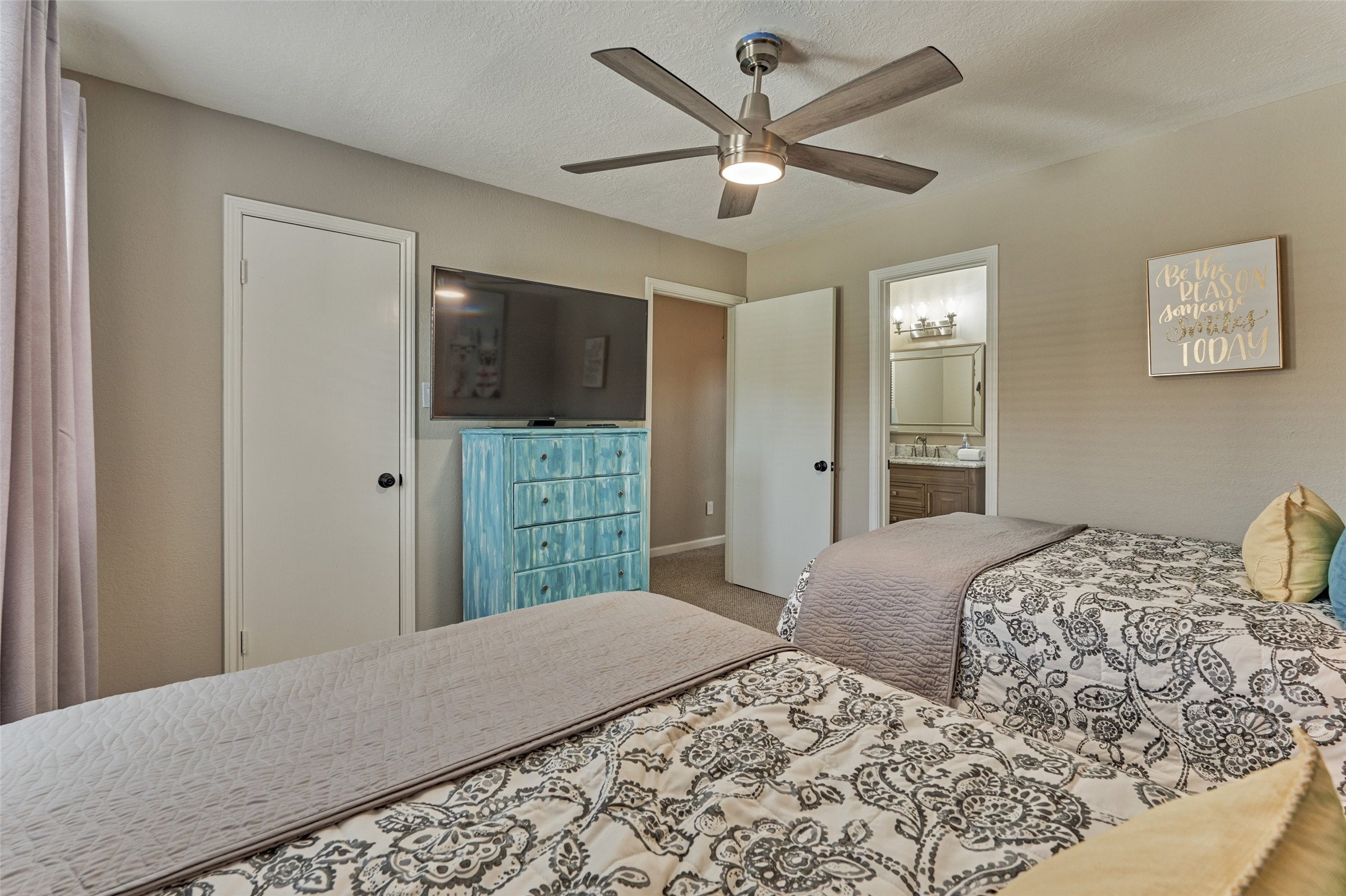5 April Point Drive South Montgomery, TX 77356 - Photo 20 of 26 a bedroom with a bed and a flat screen tv