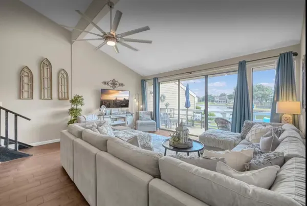 a living room with furniture and a large window