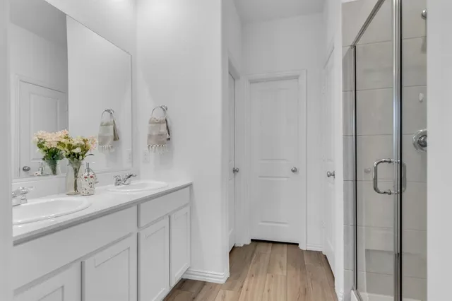 a bathroom with a sink and mirror