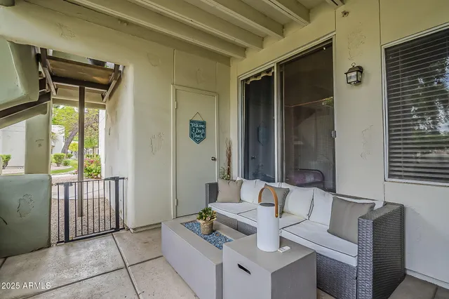 a view of a livingroom with furniture and windows