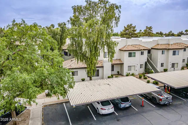 an aerial view of residential houses with outdoor space