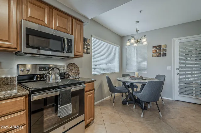 a kitchen that has a stove and a microwave
