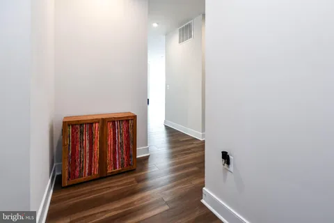 a kitchen with a sink a stove and cabinets