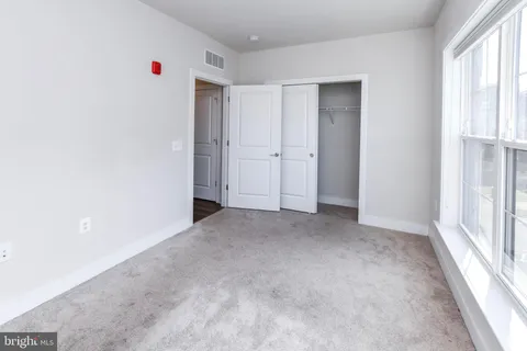 a kitchen with stainless steel appliances a refrigerator sink and microwave