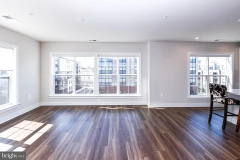 a kitchen with stainless steel appliances a stove microwave and refrigerator