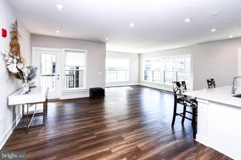 a kitchen with cabinets and stainless steel appliances
