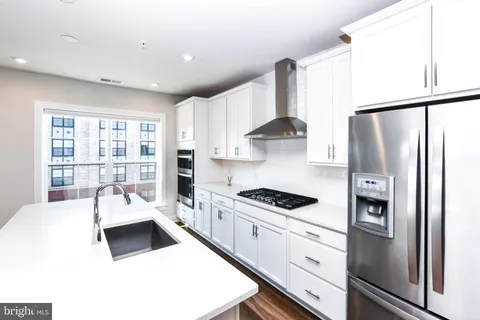 a bathroom with a sink a toilet and a shower