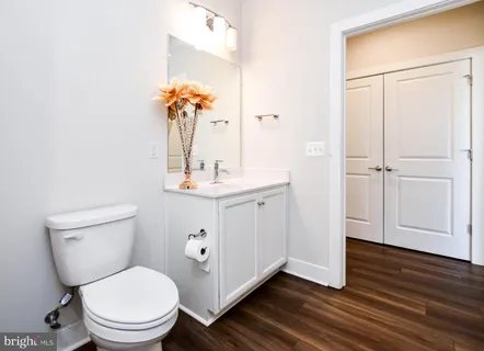 a bathroom with a sink a vanity and a mirror