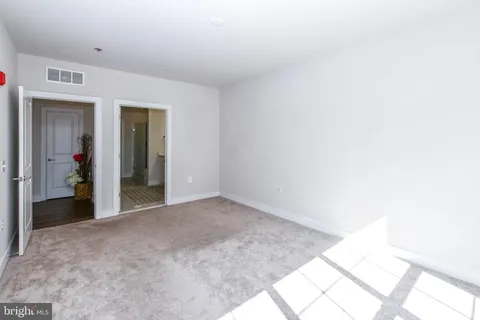 a view of a ocean with boats and palm trees