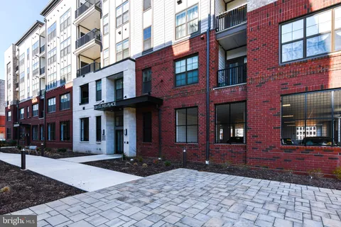a view of room with window and wooden floor