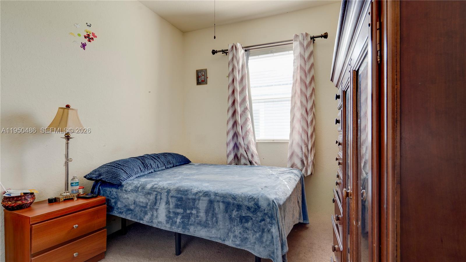 355 Northeast 31st Avenue Homestead, FL 33033 - Photo 34 of 62 a bedroom with a bed and a window