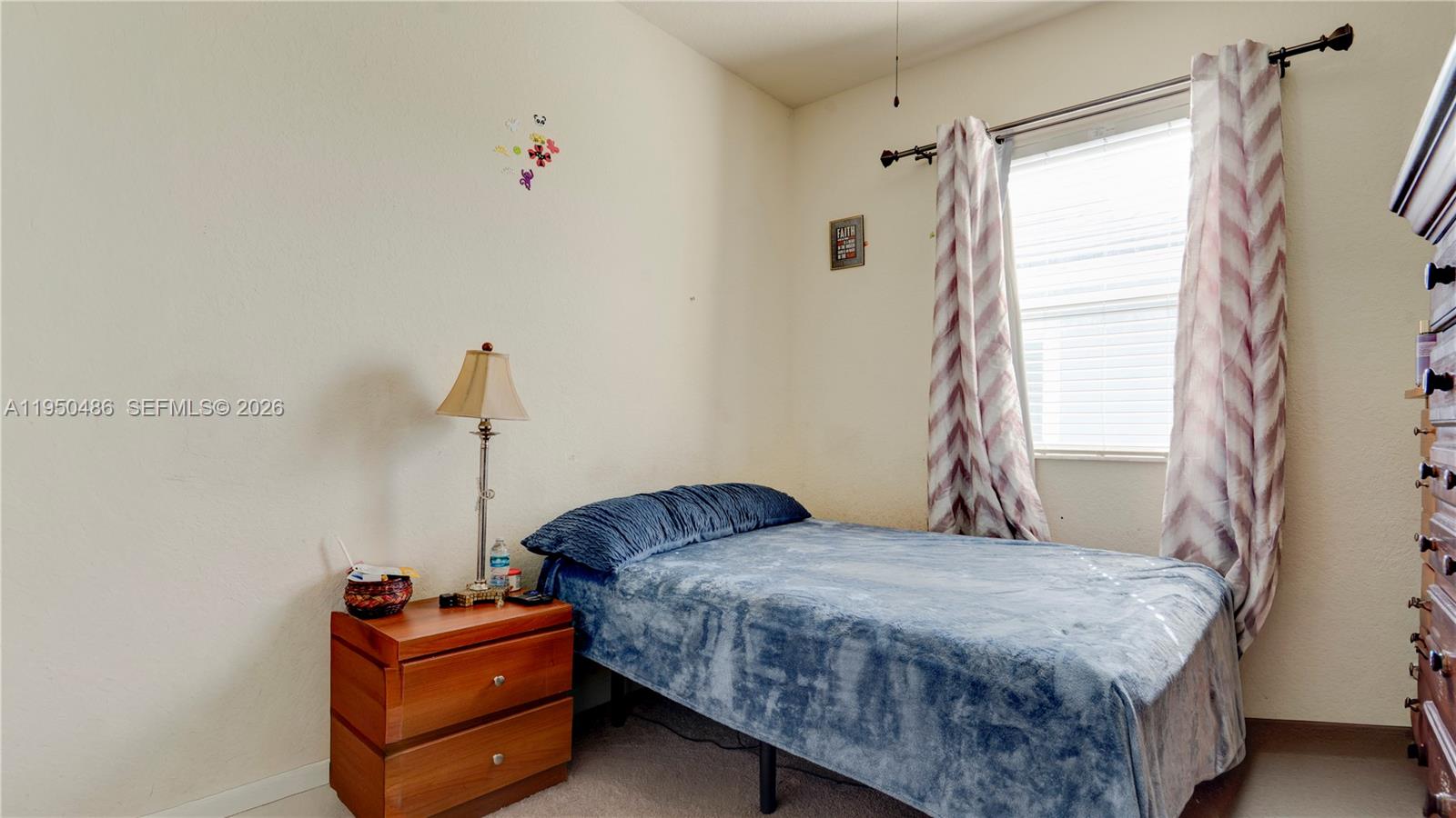 355 Northeast 31st Avenue Homestead, FL 33033 - Photo 35 of 62 a bedroom with a bed and window