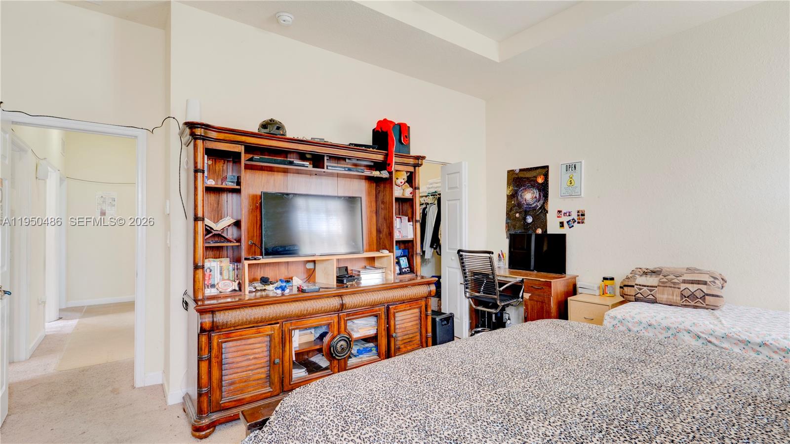 355 Northeast 31st Avenue Homestead, FL 33033 - Photo 39 of 62 a bedroom with a bed and a flat screen tv