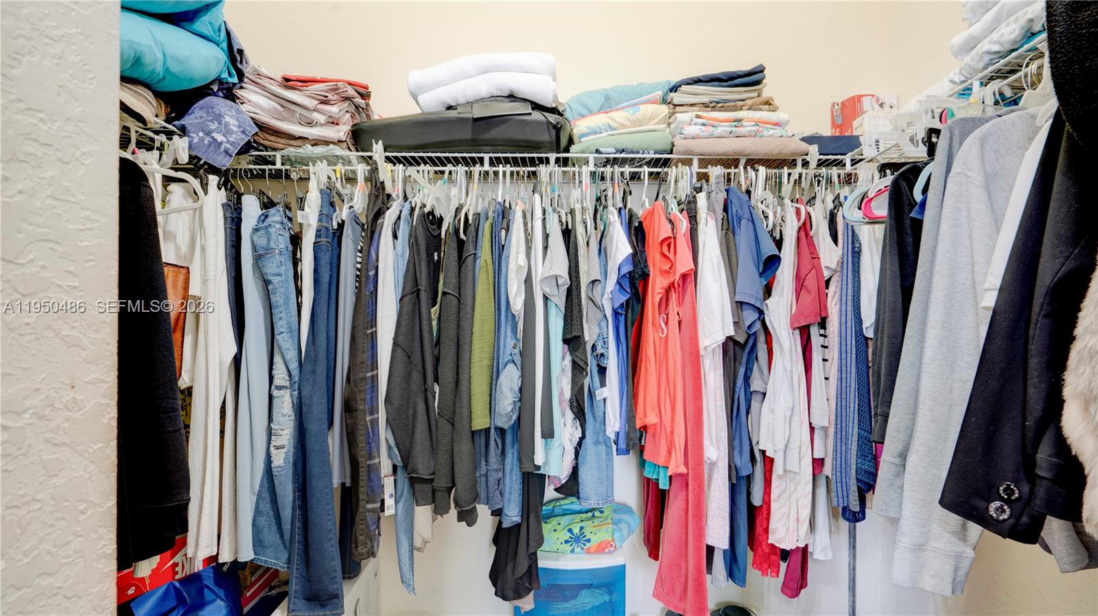 355 Northeast 31st Avenue Homestead, FL 33033 - Photo 41 of 62 a view of walk in closet with clothes and shoes
