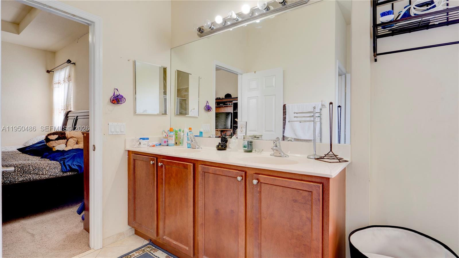 355 Northeast 31st Avenue Homestead, FL 33033 - Photo 46 of 62 a bathroom with a sink and a mirror