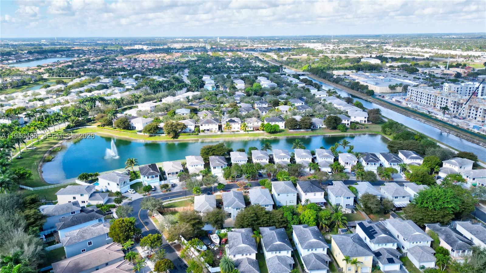 355 Northeast 31st Avenue Homestead, FL 33033 - Photo 56 of 62 an aerial view of a city with lots of residential buildings ocean and mountain view in back