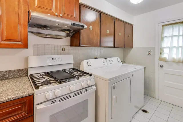 a kitchen with a stove and a refrigerator