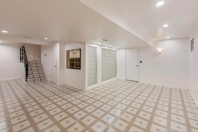 a view of a big room with windows