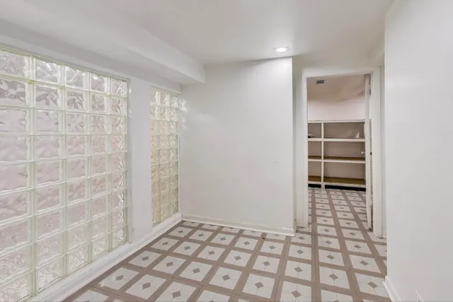 a bathroom with a sink a mirror and shower