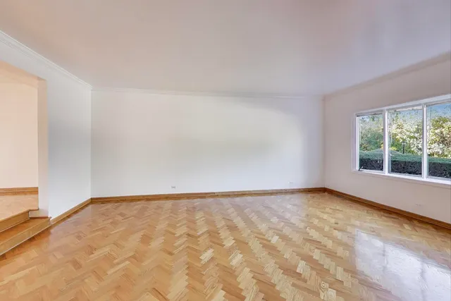 a view of an empty room and window