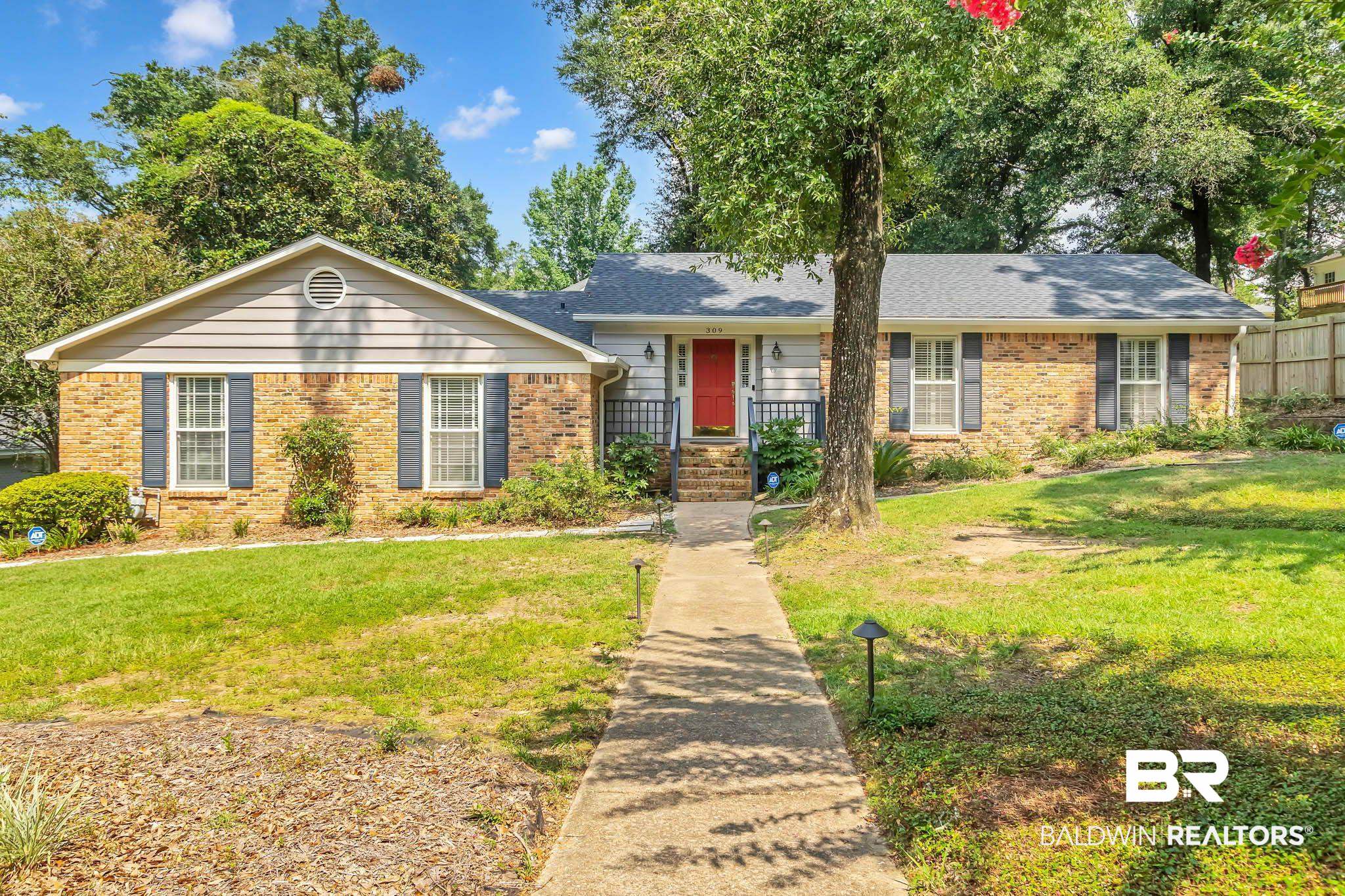 309 West Brandy Run Road Mobile, AL 36608 - Photo 1 of 100 Ranch-style house featuring brick siding, a front yard, and a shingled roof