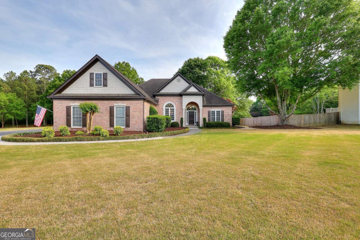 2385 Amberbrook Lane Grayson, GA 30017 - Photo 1 of 57 a front view of house with yard and green space
