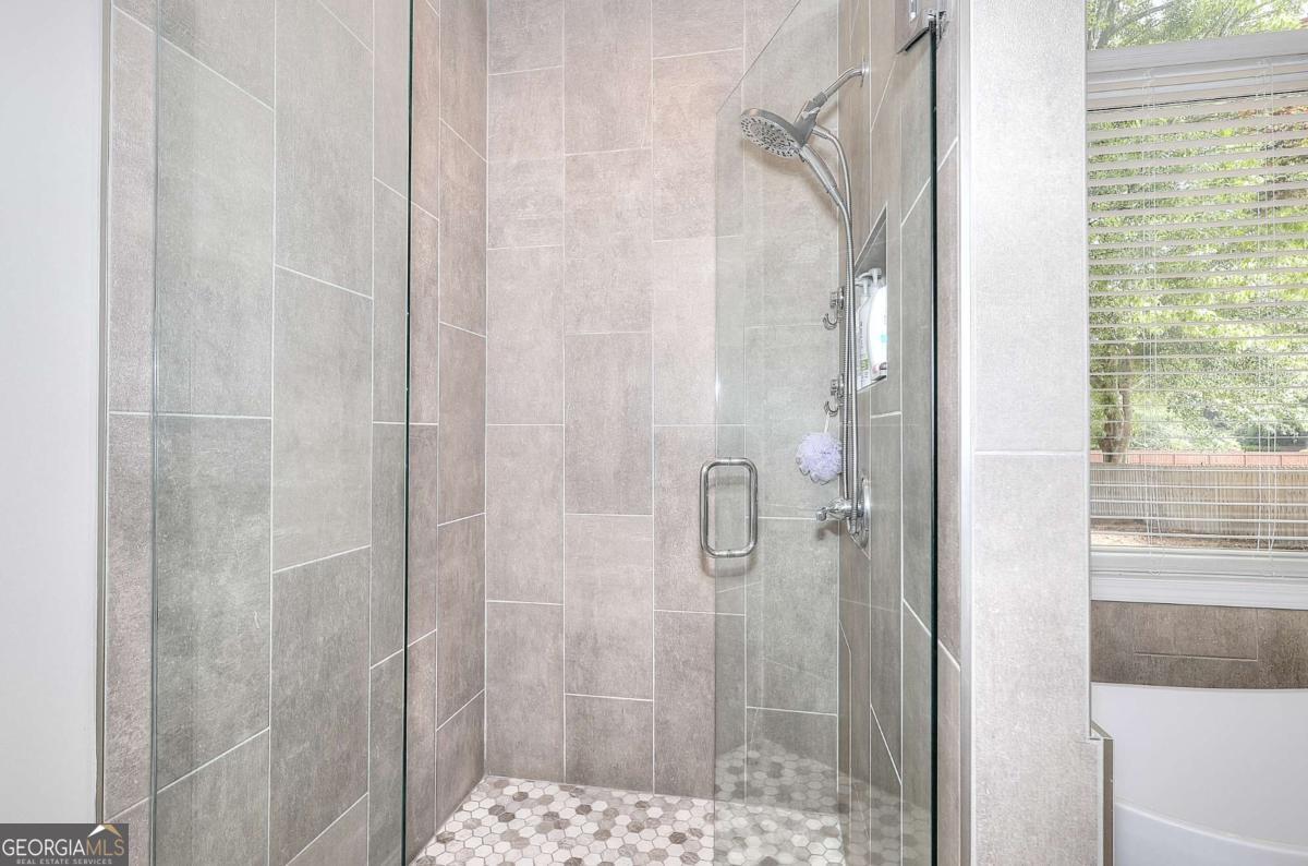2385 Amberbrook Lane Grayson, GA 30017 - Photo 27 of 57 a bathroom with a shower