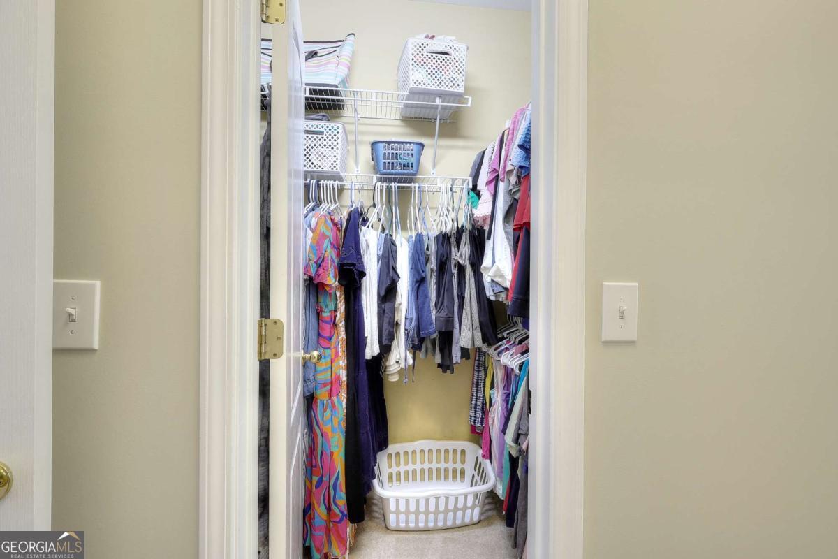 2385 Amberbrook Lane Grayson, GA 30017 - Photo 28 of 57 a view of walk in closet with clothes