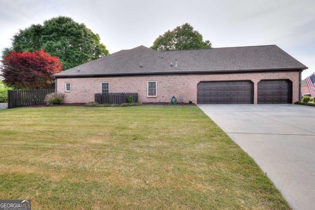 2385 Amberbrook Lane Grayson, GA 30017 - Photo 3 of 57 a house view with a garden space