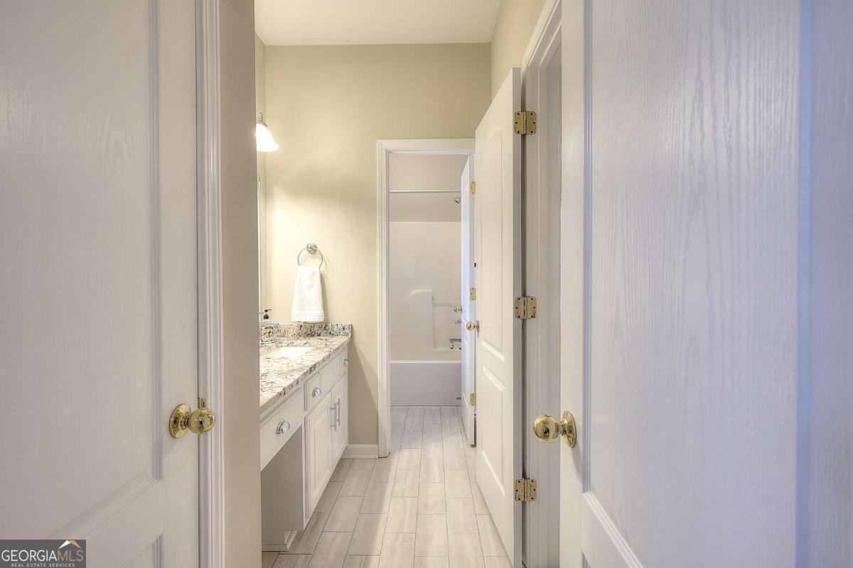 2385 Amberbrook Lane Grayson, GA 30017 - Photo 33 of 57 a view of a bathroom from a hallway