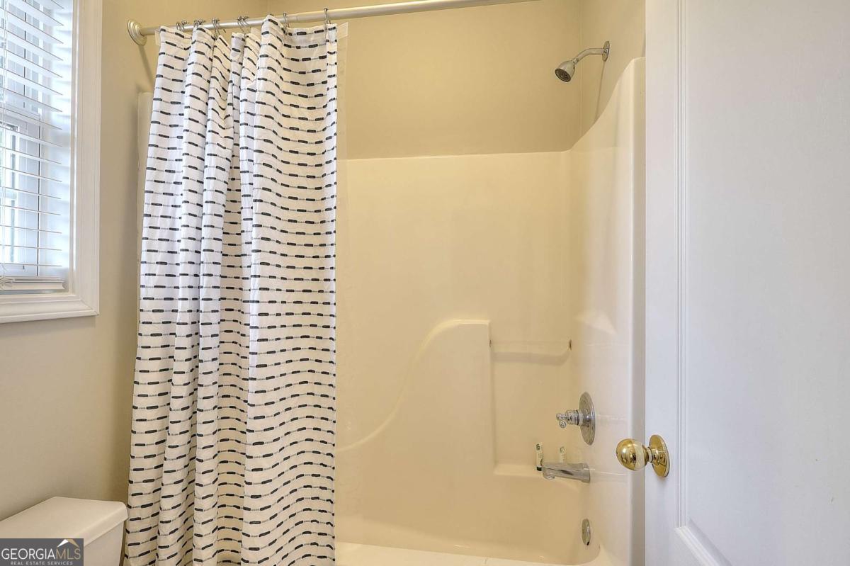 2385 Amberbrook Lane Grayson, GA 30017 - Photo 35 of 57 a bathroom with a shower