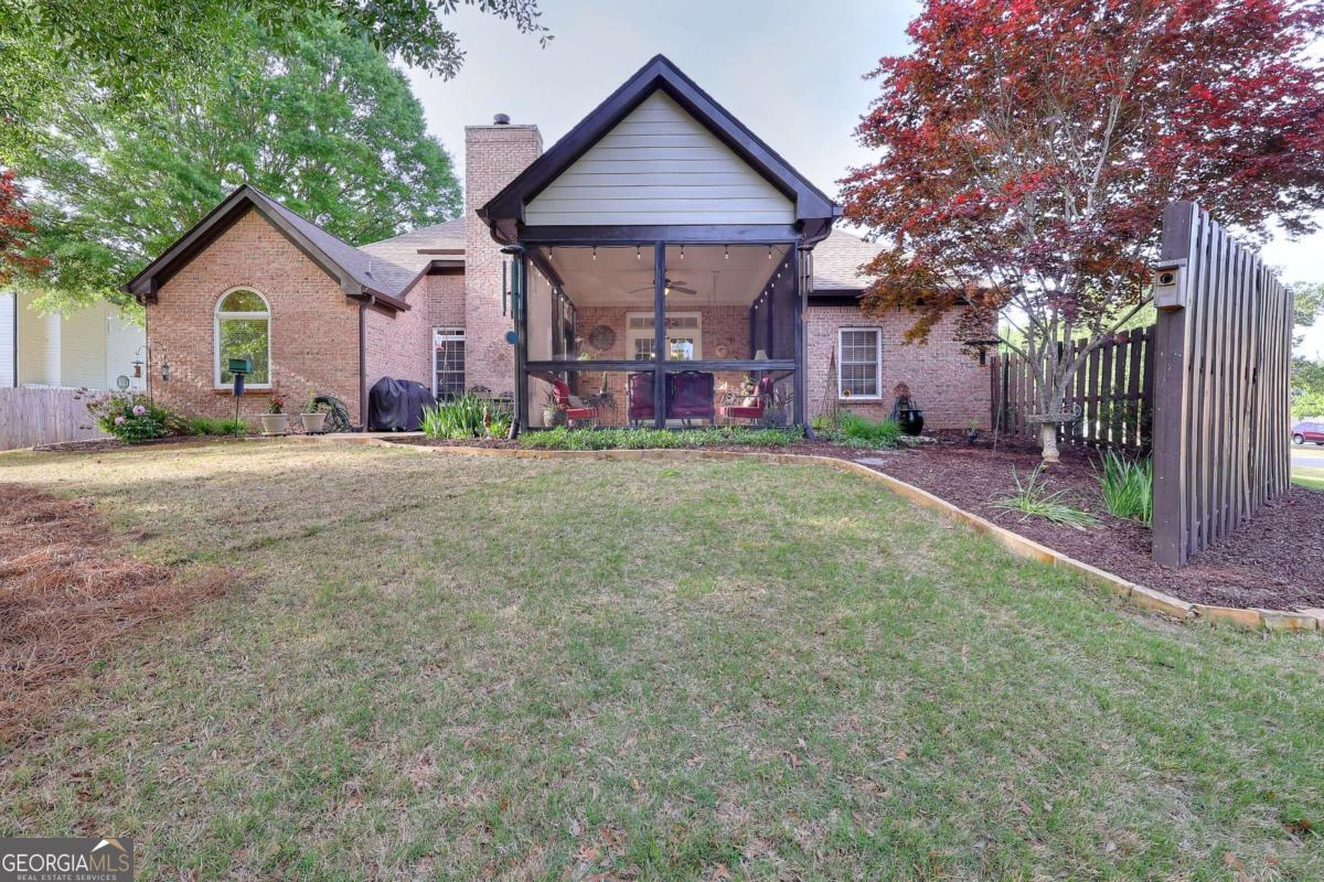 2385 Amberbrook Lane Grayson, GA 30017 - Photo 46 of 57 a front view of a house with a yard and garage