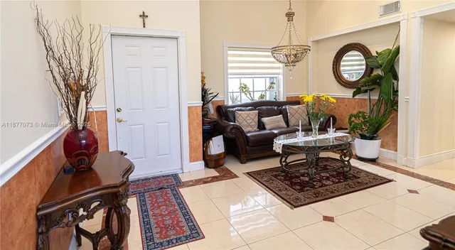 a kitchen with stainless steel appliances granite countertop a sink a stove and a wooden cabinets