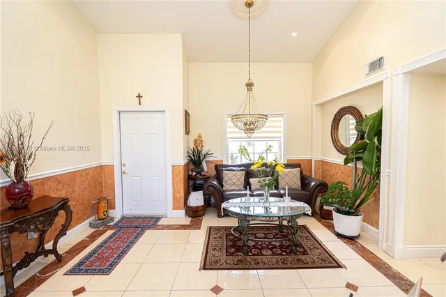 a dining room with furniture a window and kitchen view