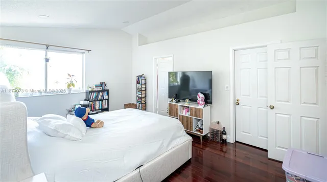 a view of a chairs and table in the back yard of the house