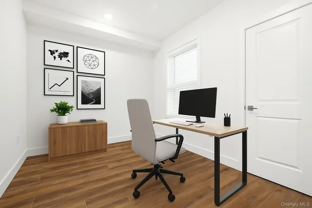 a view of a workspace with furniture