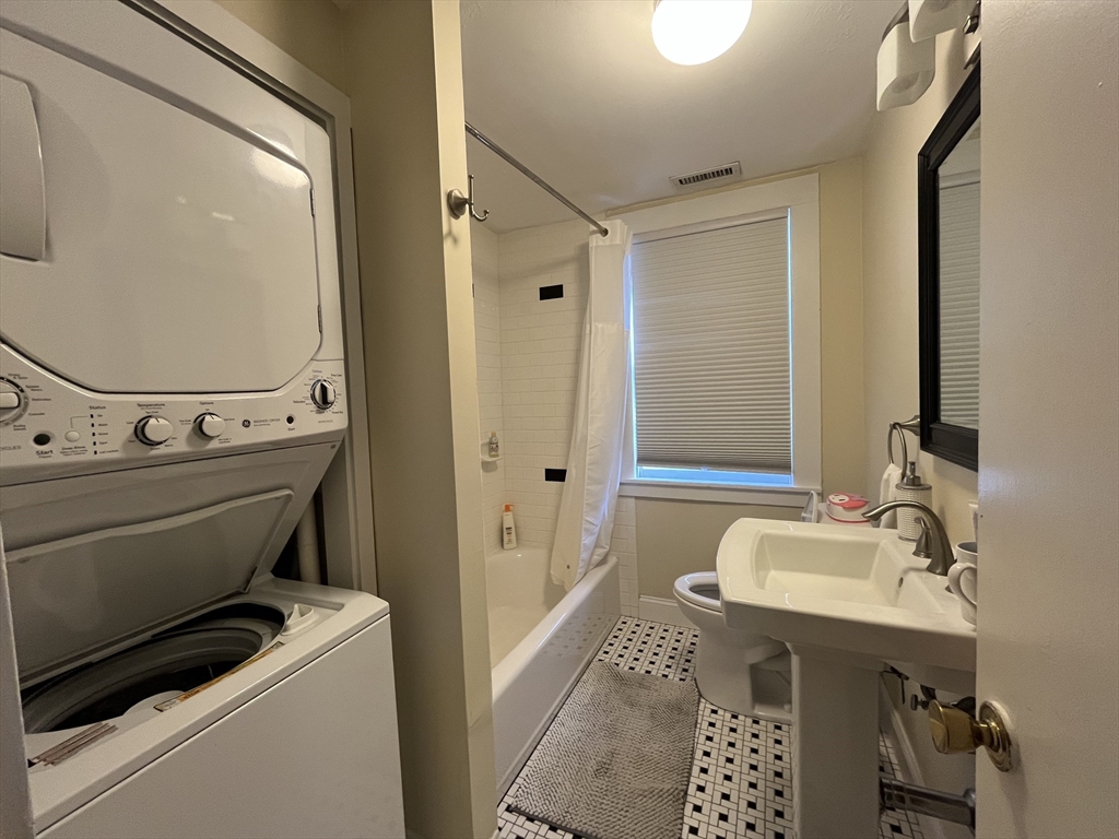106 Main Street, Unit 2 Andover, MA 01810 - Photo 5 of 11 a bathroom with a sink a toilet and shower