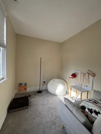 a room with furniture and a window