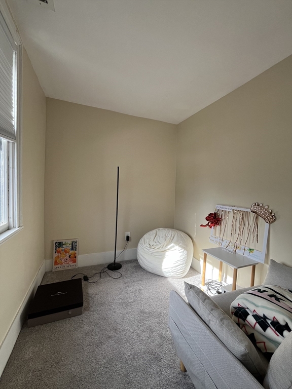 106 Main Street, Unit 2 Andover, MA 01810 - Photo 8 of 11 a room with furniture and a window