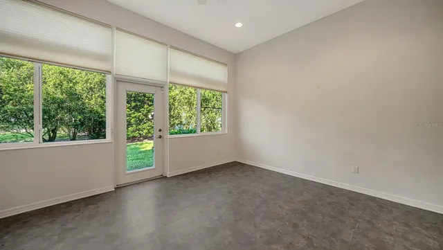 a kitchen with stainless steel appliances granite countertop a refrigerator a stove microwave and cabinets