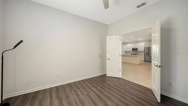 a view of a balcony with wooden floor and lake view