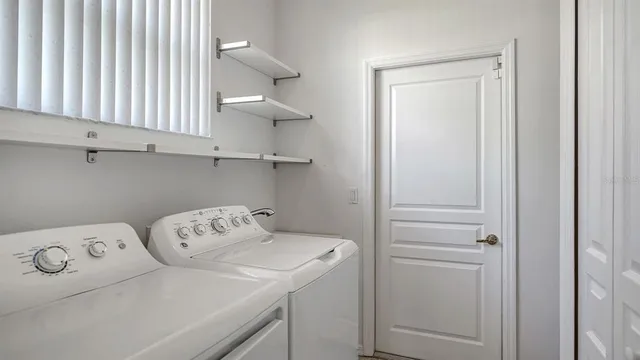 a view of a lake with houses in the background